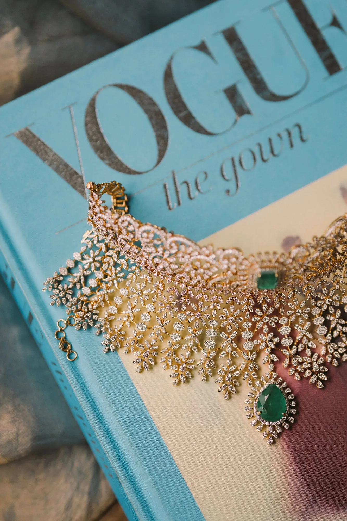 An emerald and diamond bridal choker, photographed before the ceremony